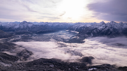 Fototapeta na wymiar clouds over the winter mountain valley