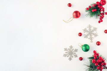 Christmas composition. Christmas red and silver decorations on white background. Flat lay, top view, copy space	