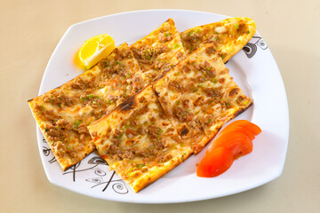 Kiymali pide. Turkish pide with minced meat. Turkish pizza mince pita Pide on white background. Etli ekmek. Kusbasili pide.
