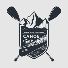 Canoe tour emblem - canoe and two crossed paddles. Vector illustration