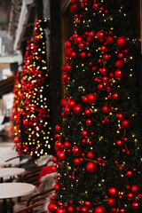 Fototapeta na wymiar Beautiful Christmas decoration, lights and red decor balls and gold lights. Christmas time, bokeh