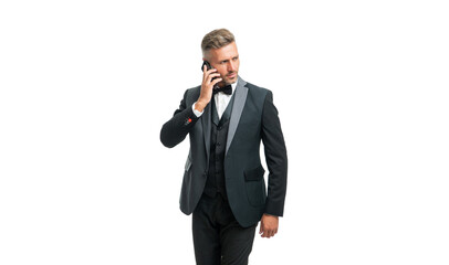 busy gentleman in tuxedo speak on phone isolated on white background