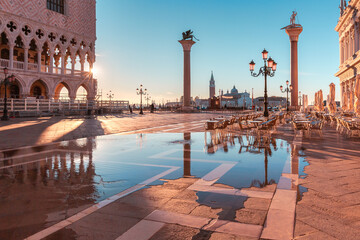 Beautiful sunrise on sea promenade at San Marco square in Venice, Italy