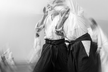 Aikido lifestyle. Black and white sports background in the style of film photography with motion...