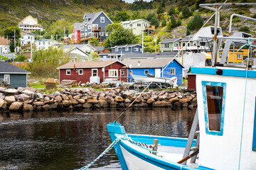 Fishing boat overlooking a small harbour village in the maritimes.