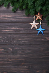 Winter background with fir branches and Christmas decorations in form of star