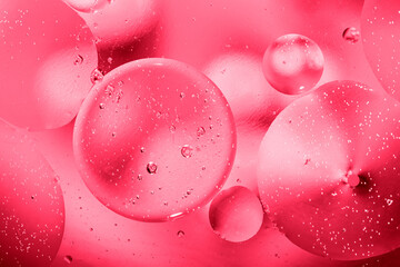 Year 2023 color Viva magenta. Abstract background oil in water