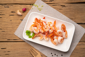 Shrimps, Boiled Prawns in white plate, Shrimp tails ready for cooking,Seafood ingredient.Top view