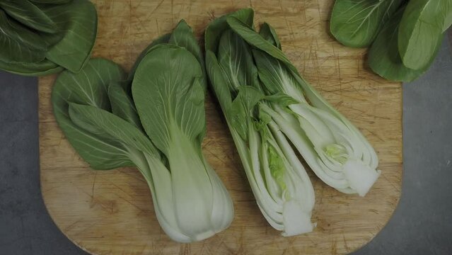 Endives on a wooden cutting board (Cichorium intybus). Fresh chicories