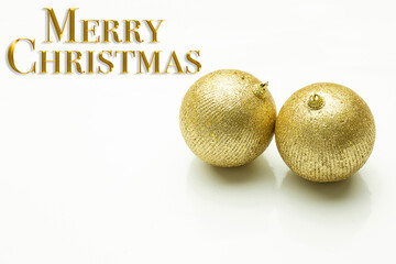 Christmas decoration. Text in golden letters wishing Merry Christmas.