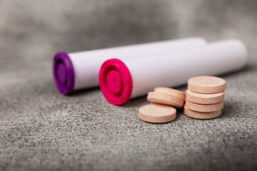 Multivitamin effervescent tablets. Soluble tablets of vitamin C. Calcium vitamin. Effervescent vitamin on a marble background. Medicine concept. Immunity.Place for text.