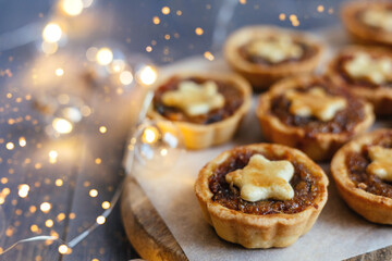 Christmas mince pies with fruit filling on a gray background.