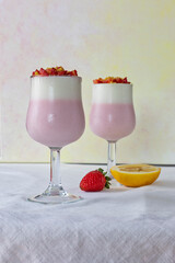 Two glasses with pink straberries mousse. 