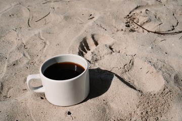 morning coffee on a white picnic table in front of a tropical island beach in Nigril, Jamaica