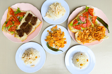 Table scene of assorted take out or delivery foods. Traditional Turkish cuisine. Various Turkish meal and appetizers. Top down view on a table.
