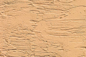 Light warm cream color beige old abstract plaster pattern wall texture stucco background