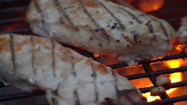 Grilling Chicken Fillet On Charcoal Griller. - close up