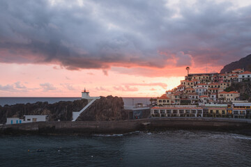 Naklejka premium Small town in Madeira Camara de Lobos at sunset