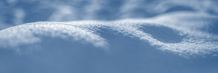 winter snow background - snow covered wavy uneven ground surface