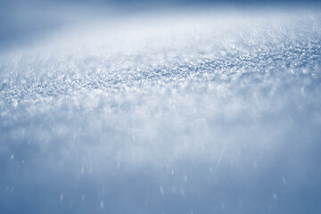 winter snow background - snow covered surface and artistic bokeh
