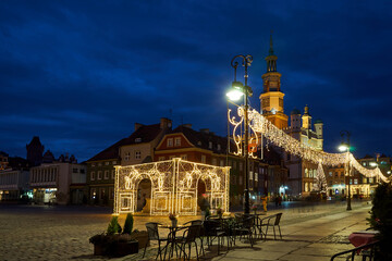 the facade of Renaissance town hall and christmas decorations in city of Poznan, monochrome
