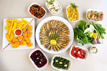 Traditional Turkish cuisine. Pizza, pita, pidesi, sucuk, hummus, kebab. Many dishes on the table. Serving dishes in restaurant. Background image. Top view, flat lay