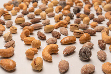  A group of almonds, pistachios, walnuts, macadamia, cashews.