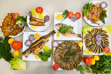 Traditional Turkish cuisine. Pizza, pita, pidesi, sucuk, hummus, kebab. Many dishes on the table. Serving dishes in restaurant. Background image. Top view, flat lay