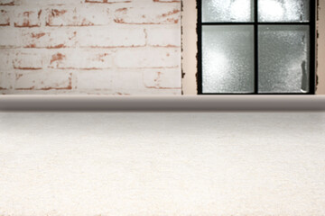 A wintry empty room with fluffy thick carpet offers Copy Space. In the background is a white...
