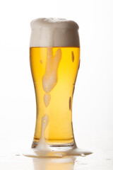 Glass of light beer isolated on white background, foam, bubbles, close-up