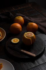 The process of cutting the peel of oranges for drying