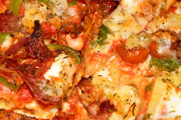 Close Up of a Cheese and Meat Pizza Dinner with Herbs