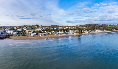 An aerial view along the coastline of the village of Saundersfoot, Wales in winter