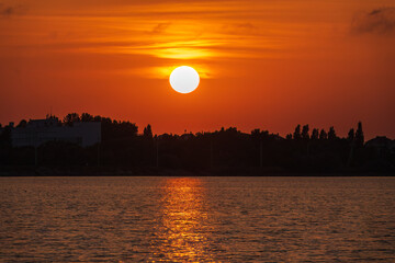 The sun goes down over a lake