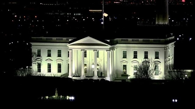 Aerial White House at Night Flag Half Staff