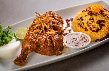 zereshk polow, pulao and biryani served in dish isolated on grey background top view of arabic food