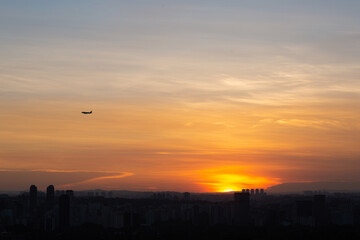 Airplane preparing to land  during summer sunset.