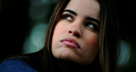 Fototapeta premium Pensive woman, thoughtful girl pondering solution, close-up face