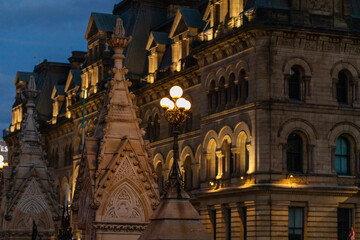 Cityscape of downtown Ottawa, Canada at night with street lights and historic government buildings. - obrazy, fototapety, plakaty