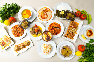 Traditional Turkish cuisine. Pizza, pita, pidesi, sucuk, hummus, kebab. Many dishes on the table. Serving dishes in restaurant. Background image. Top view, flat lay