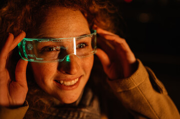 Smiling woman with glowing smart glasses on the street. Close up.