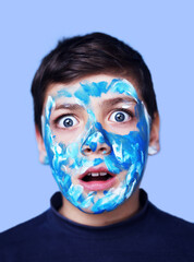 Funny children portrait  with face painting on color background