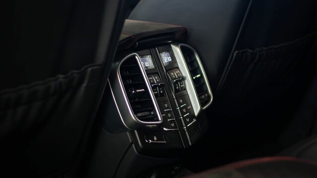 Closeup of Porsche Cayenne GTS Old Generation air conditioning controls for the second row