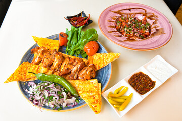 Chicken wings barbeque in a dish with BBQ grill sauce . Izgara tavuk kelebek sis kanat. Tavuk sis, gogus.