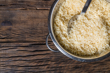 beautiful rice in a bowl on a dark wooden background
