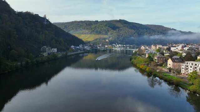 Aerial Drone Shot in autumn of Traben-Trarbach with Morning Fog. River Moselle in early fall, Germany. Moselland.