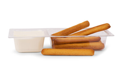Tasty crispy sticks with pitcher with sour cream isolated on white