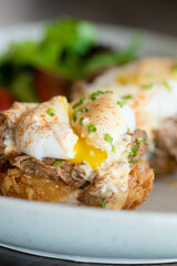 eggs benedict with yolk coming out
