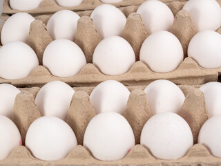Chicken eggs in a package. White eggs in a box.