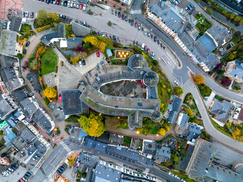 Aerial drone Shot of town CLervaux on the north of Luxembourg. Twilight evening scene with Castle and Cathedral
